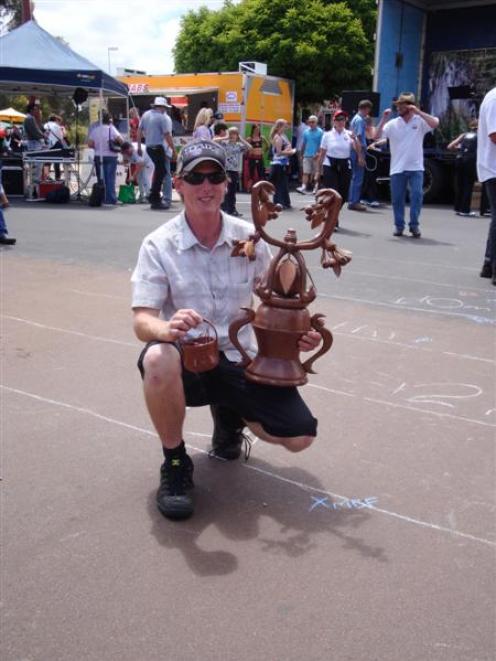 Wanaka builder Mike Bassett with the Australasian cherry pip spitting championship trophy. Photo...