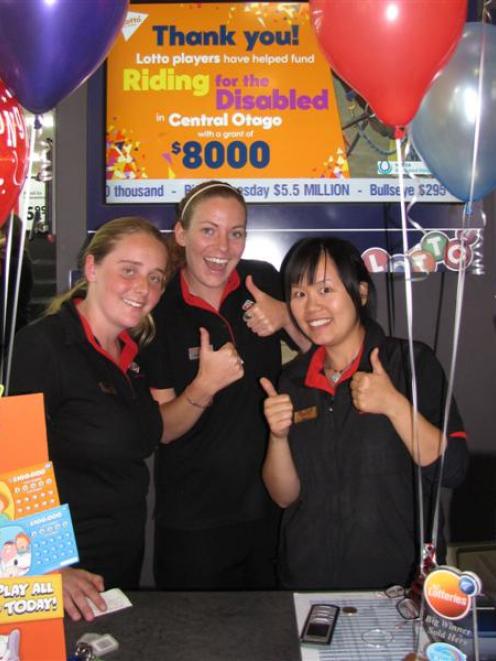 Wanaka New World Lotto staff (from left) Natasha Yeo, Melissa Foss and Shelly Chou wait for...
