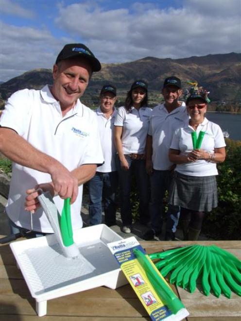 Wanaka painter Brett Stanley demonstrates his Rolla-Wipa, which he and a marketing team of (from...