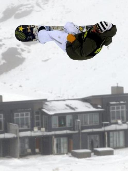 A snowboarder soars above Wanaka's Snow Park. Photo by NZPA.
