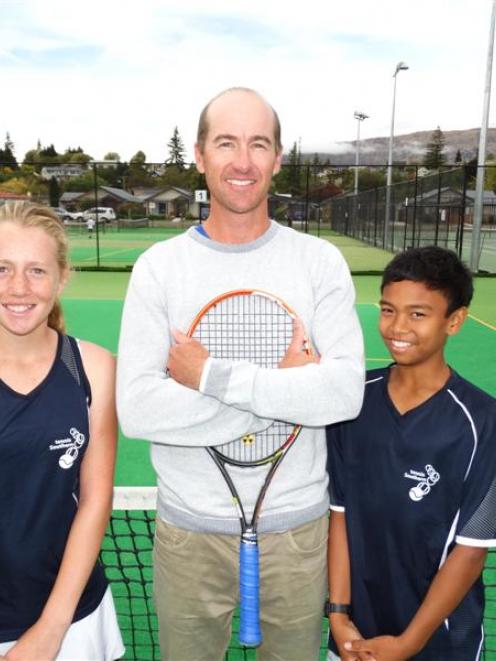 Wanaka Tennis Club coach Perry Crockett celebrates 10 years in the role with young proteges Ines...