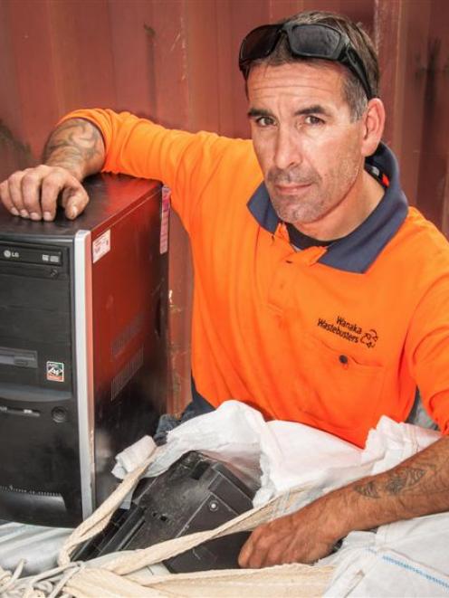Wanaka Wastebusters guardian Matt Plant with some of the electronic waste saved from the landfill...