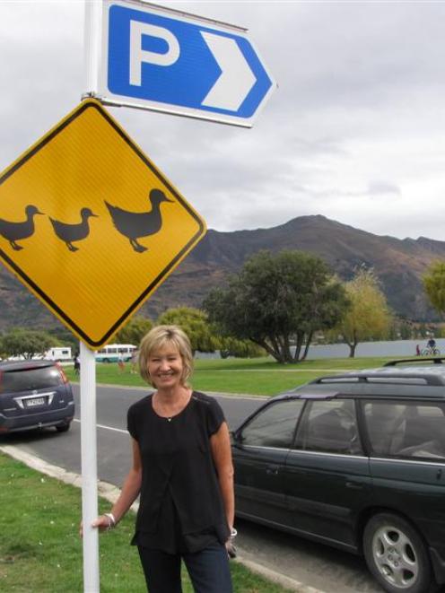 Wanaka woman Karen Neilsen with one of the resort's new lakefront ''ducks crossing'' signs for...