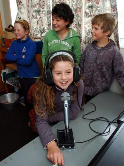Warrington School pupil Naomi Ashby-Ryan (9) "shouts out" to her friends on Blueskin Bay FM (88.2...