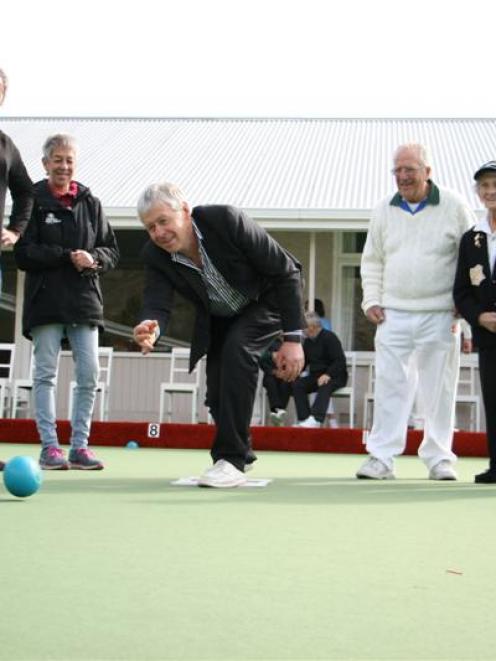 Watching Central Otago Mayor Tony Lepper roll the first bowl on Saturday are (from left) Central...
