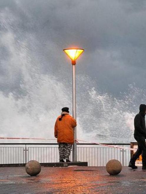 Waves pound the sea wall at St Clair beach in Dunedin. Photo ODT files