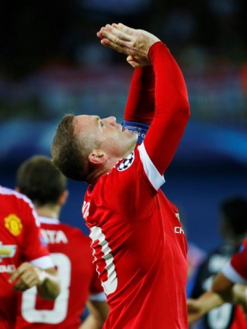 Wayne Rooney celebrates after scoring his first goal. Photo Reuters