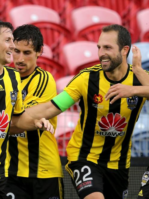 Wellington Pheonix team mates celebrate a goal during the round 10 A-League match between the...