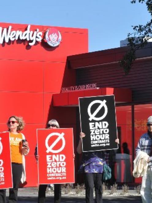 Protesters gather outside the new Wendy's outlet in Andersons Bay Rd, Dunedin, to protest about...