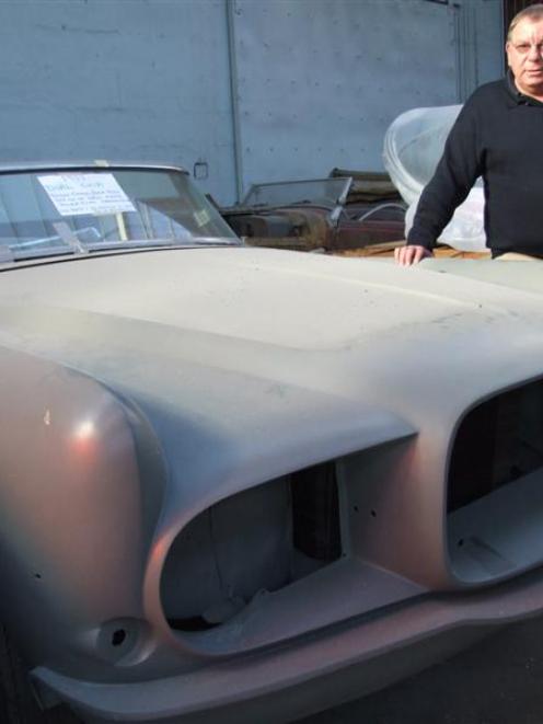 Wes Davies views a rare 1957 Dual Ghia at Tempero Coach and Motor Company. Photo by Sally Rae.