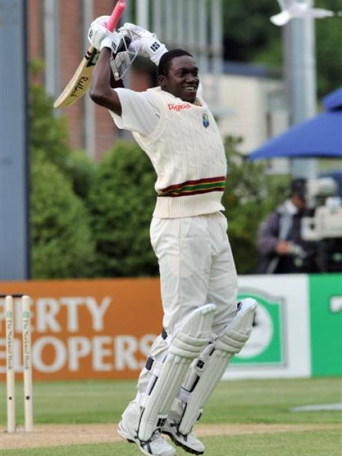West Indies fast bowler Jerome Taylor shows his delight at scoring his maiden test century...