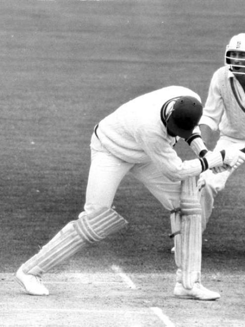 West Indies fast bowler Joel Garner is bowled as Stephen Boock looks on nervously during the...