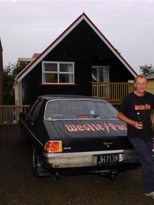 Westpac's Grant Andrews outside a flat which is available rent free for three lucky students. The...