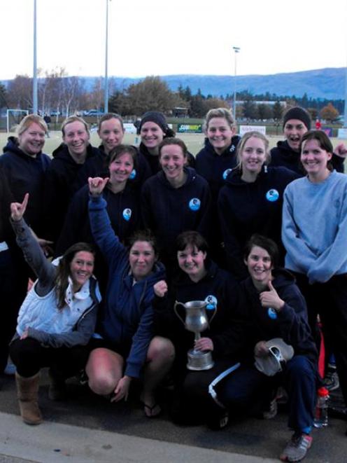 What a feeling ... Queenstown hockey premiers take the Trust Bank Southland champions trophy from...