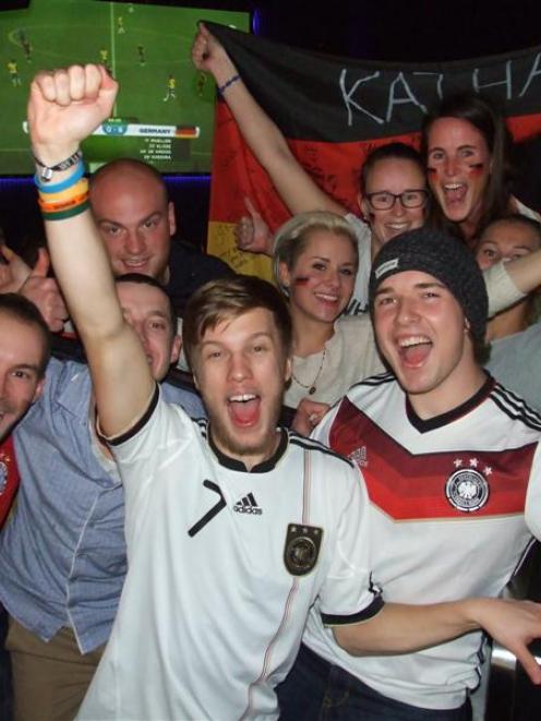 German supporters at Queenstown's Xtreme bar celebrate another goal during their nation's 7-1...