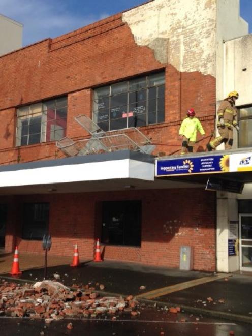 Wild weather was blamed for the collapse of part of this building facade on Tay St in...