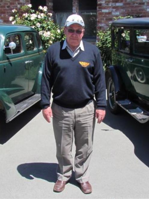 Windsor Rally organiser John Miller, with his 1937 Chevrolet Tour Sedan to his right and his 1928...