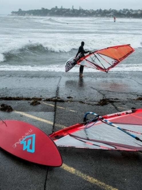 Windsurfers headed to Takapuna Beach on Auckland's North Shore yesterday to take advantage of...