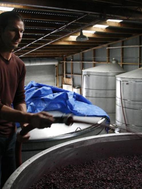 Wine production is under way in Central Otago as assistant winemaker Mike Kush extracts more...