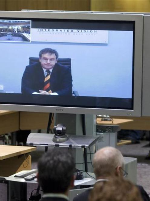 Winston Peters' lawyer Brian Henry appears before the privileges committee via video link from...