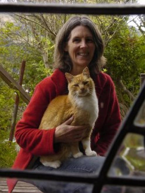 White witch Philippa Jamieson with her cat familiar, Gobi. Photo by Jane Dawber.