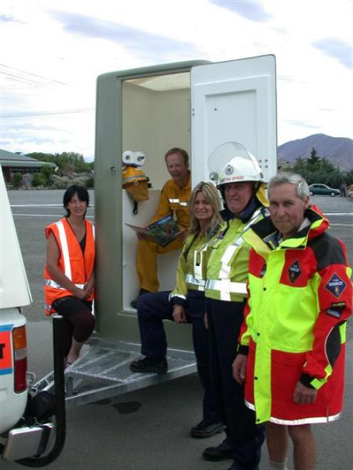 With the new toilet are (from left) Jan Perriam (Civil Defence), Craig Dawson (Waitaki Rural Fire...