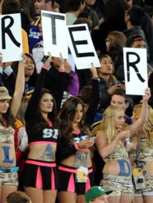 Women attempt to woo rugby fans to a Dunedin bar during a Highlanders v Blues match at Forsyth...