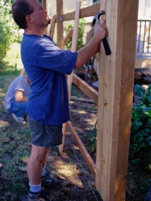 Wooden fences are especially susceptible to rot at ground level. Photo by Getty Images.