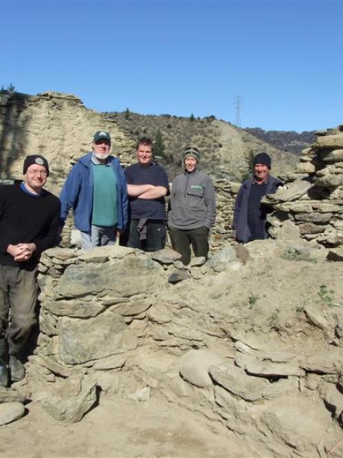 Working on the site are (from left) New Zealand Historic Places Trust archaeologist Matthew...