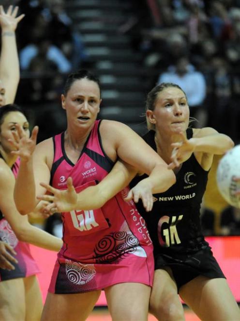 World 7's Megan Dehn, left and New Zealand's Casey Williams contest the ball in the International...