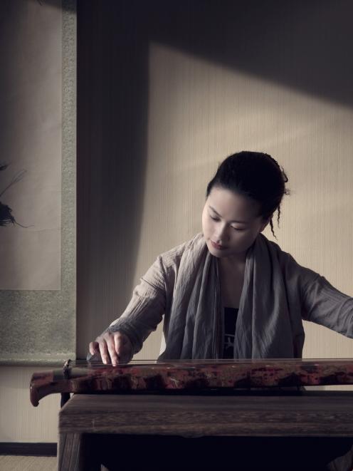 Wu Na, one of China's most accomplished players of the guqin, an ancient seven-string zither,...