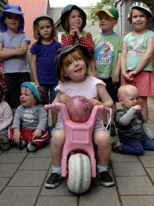 Xanthe McCabe sits on a trike similar to the dozen stolen from the Otago Polytechnic Childcare...