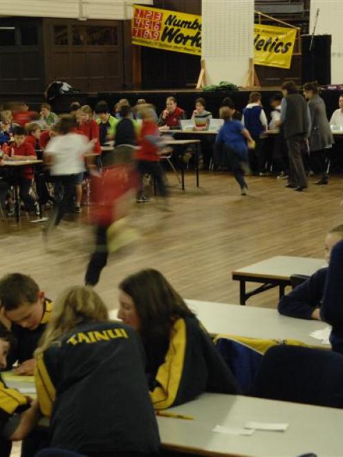 Year six pupils race to the markers with their answers during the Otago Mathletics Competition in...