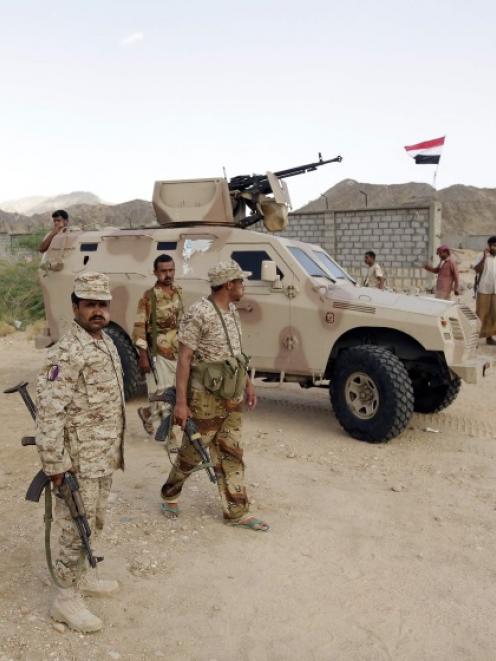 Yemeni soldiers gather at a military post in al-Mahfad in the southern Yemeni province. Photo by...