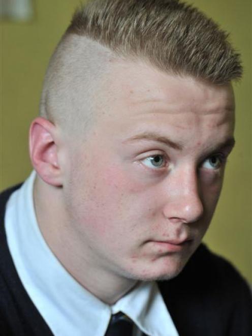 Yesterday: Kurtis Bain's new 'do has got him back in the classroom.