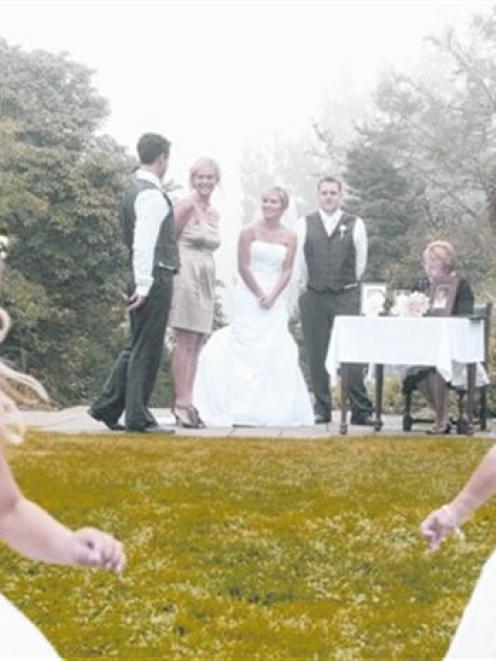 Young flowergirls enjoy free time during the signing of the register at Melanie Sharp and James...