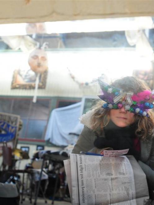 Young mask-maker Madeleine Harrop (9), of Kurow, views her reflection at the Grainstore Gallery...