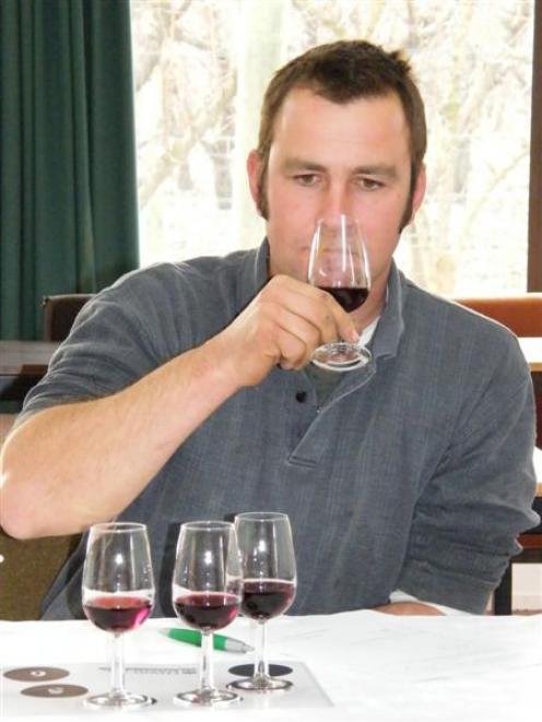 Young Viticulturist of the Year winner Tim Moorhouse (Mount Edward) samples the wines.