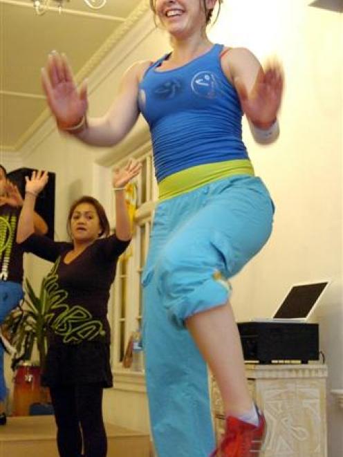 Zumba instructors Alfonso Rios and Kate Le Brun get their Zumba class in the mood to dance.