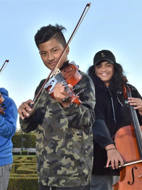 Virtuoso Strings members (from left) EJ Roebeck (12, violin), Avia Lemisio (12, viola) and Atonio...