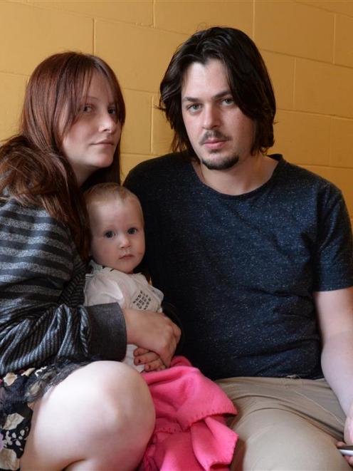 Courtney Mercer-Blake (left), daughter Evelyn Ladbrook  and partner Nathan Ladbrook take refuge...