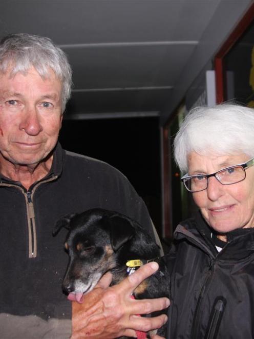 David and Trish McKenzie hold their rescued dog, Ben, last night. PHOTO: SHANNON GILLIES