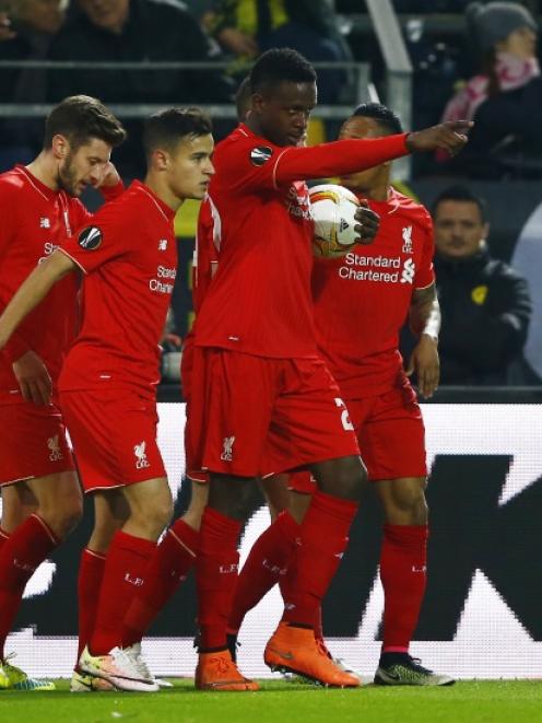 Divock Origi celebrates with Liverpool players after scoring their goal. Photo: Reuters