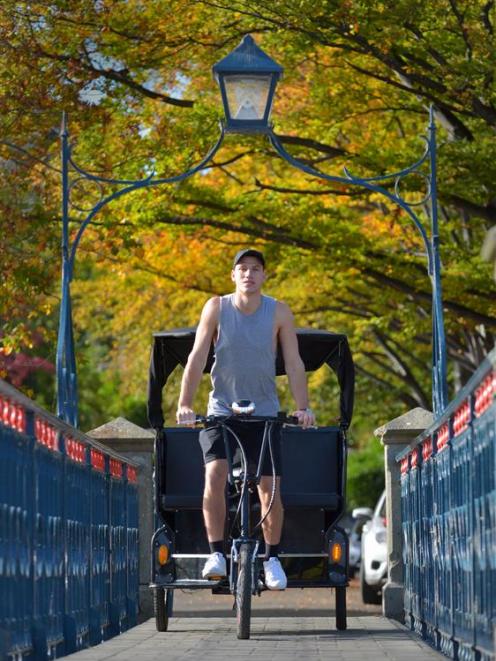 Dunedin student Tim Rogers rides his tuk-tuk through the University of Otago. Mr Rogers operates...