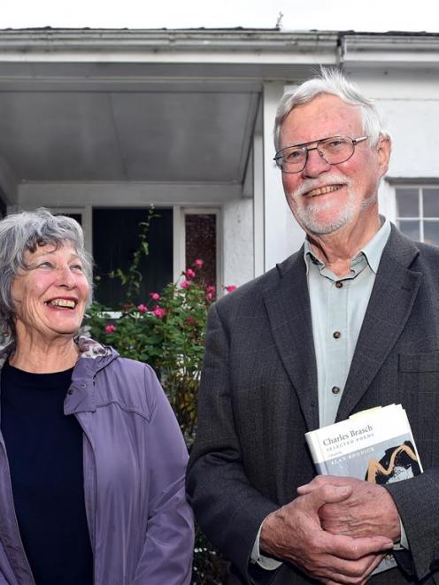 Dunedin writers Gay Buckingham and Alan Roddick outside the former home of Dunedin poet Charles...