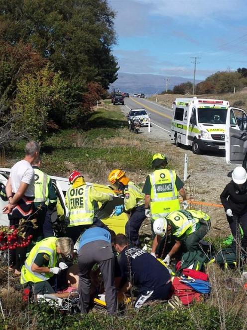 Emergency services tend to the injured in the immediate aftermath of the crash. Photo by Darren Low.