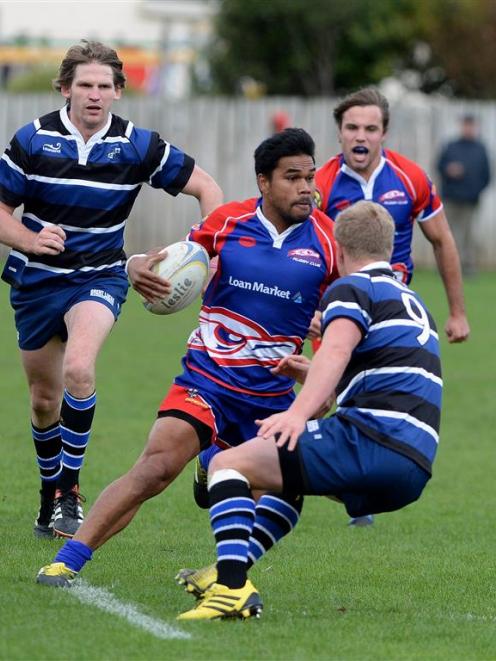 Harbour halfback Tala Fagasoaia looks to go inside his Kaikorai opposite Josh Renton, while...