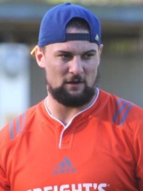 Highlanders loose forward Elliot Dixon takes part in training at Logan Park earlier this week....