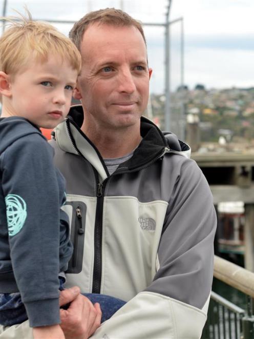 Ravensbourne volunteer firefighter Glen Turner, with son Connor (3), at the Monarch Wildlife...