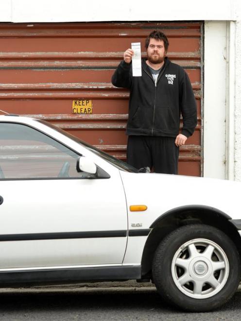 Todd Treweek holds the latest ticket issued to him. Photo: Stephen Jaquiery